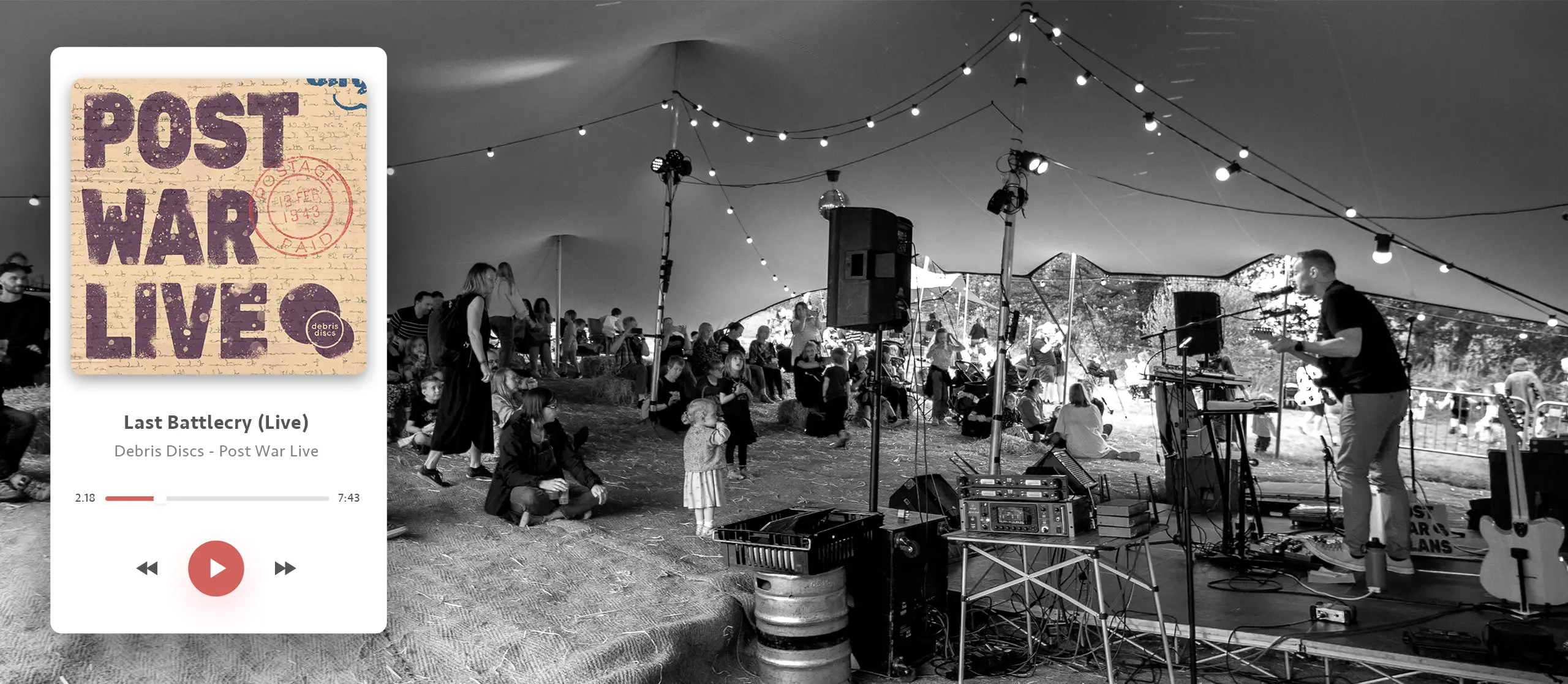 Post War Live album artwork in a mock up digital music player shown above a live photograph of Debris Discs performing to a crowd by Gavin Stretch