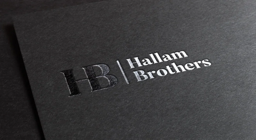 New Hallam Brothers logo design by Gavin Stretch of Mode=Create shown as silver foil stamp on black card.